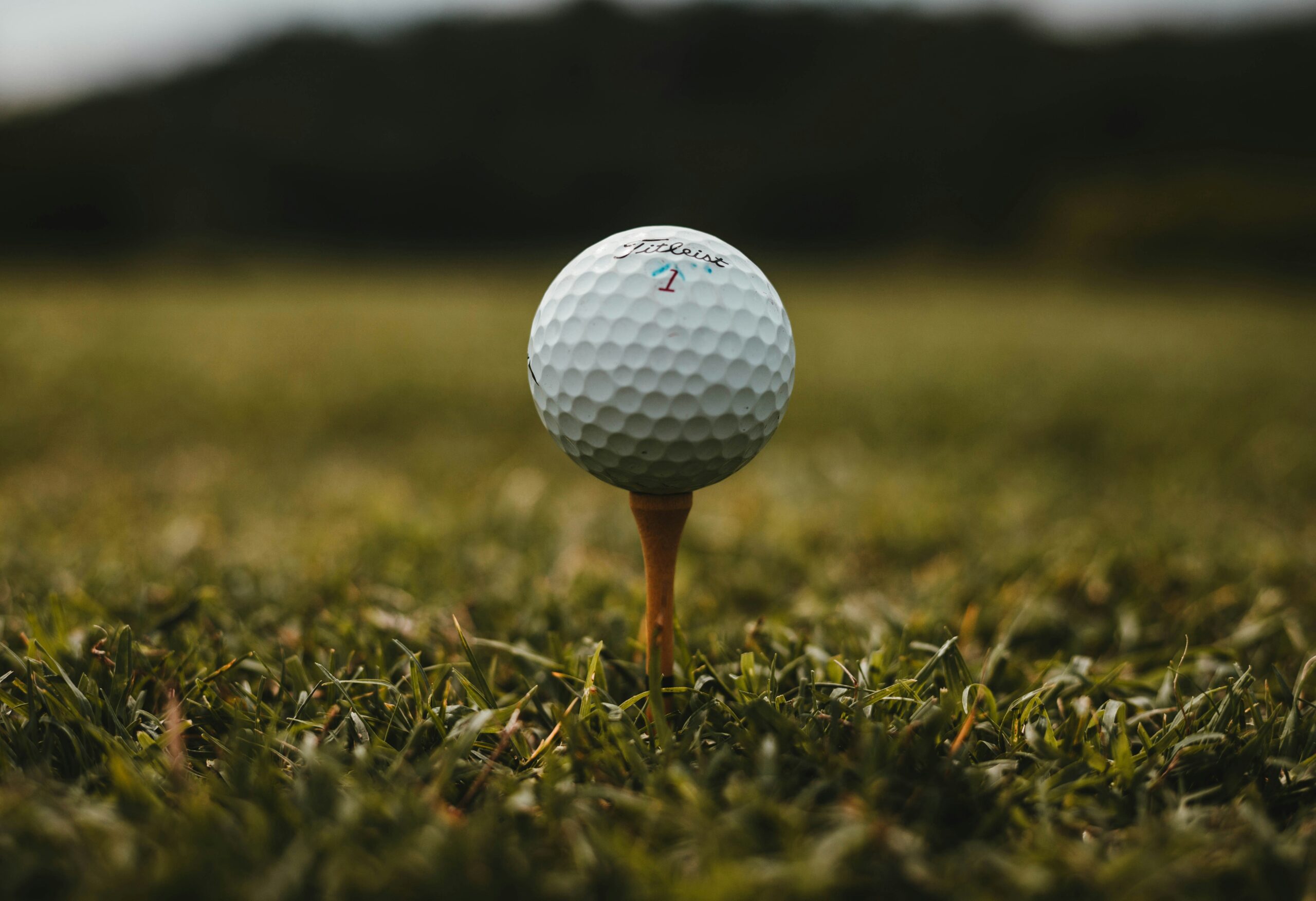 Golfers playing on a golf course fairway